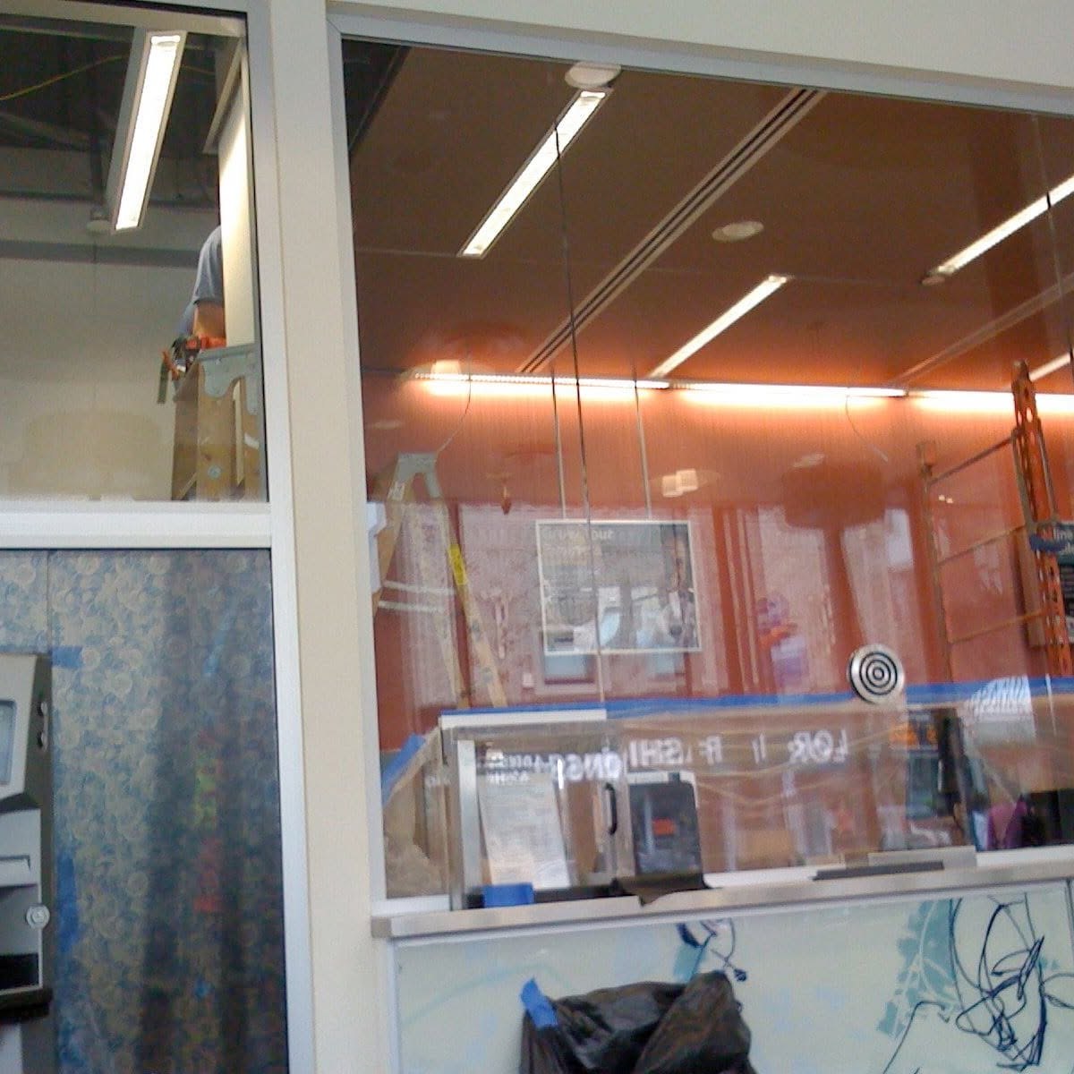 LED strip lighting retrofit above a bank teller counter
